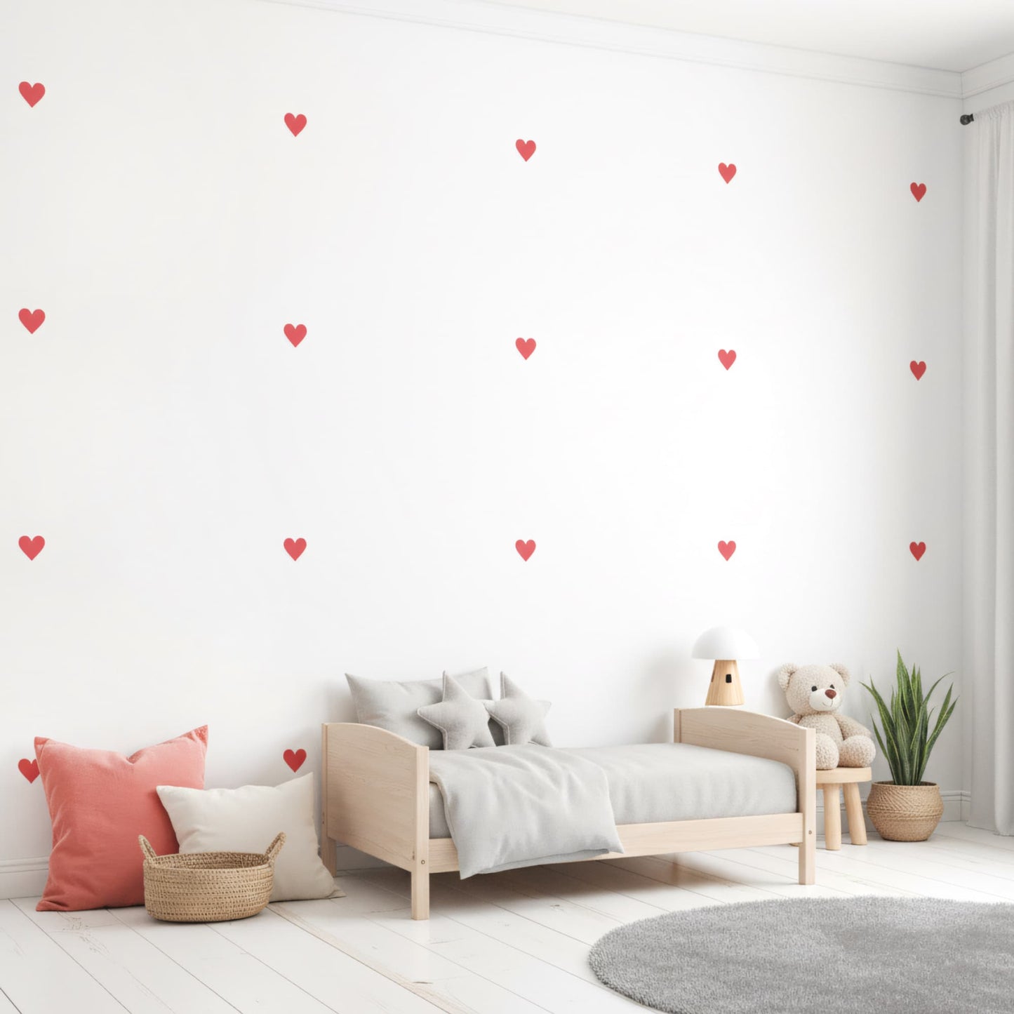 Une décoration murale pleine d'amour avec des stickers muraux cœurs rouges amour dispersés, parfaits pour la chambre de bébé et le coin lecture.