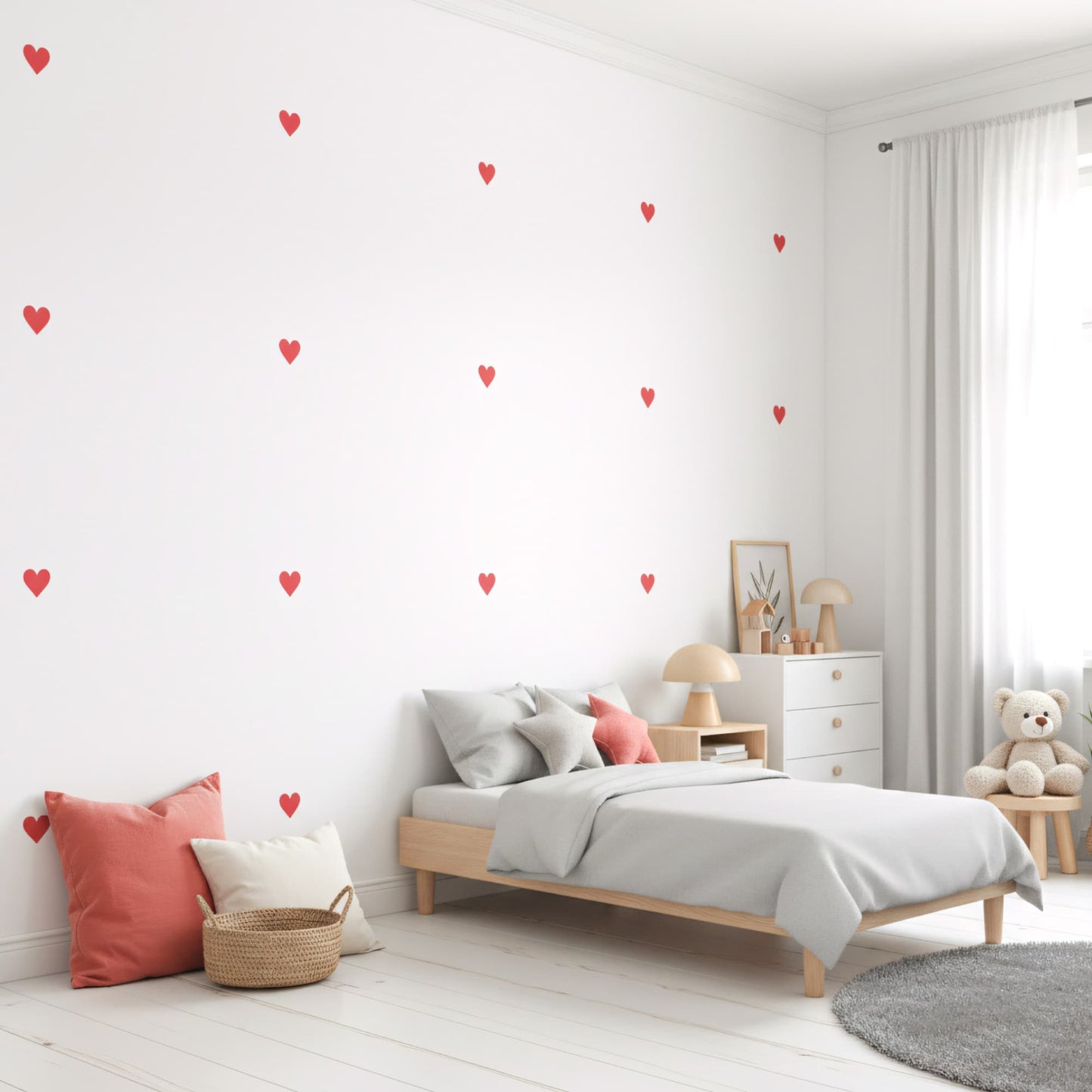 Stickers cœurs rouges amour sur un mur blanc, créant une décoration murale vive et affectueuse pour une chambre d'enfant au Maroc.