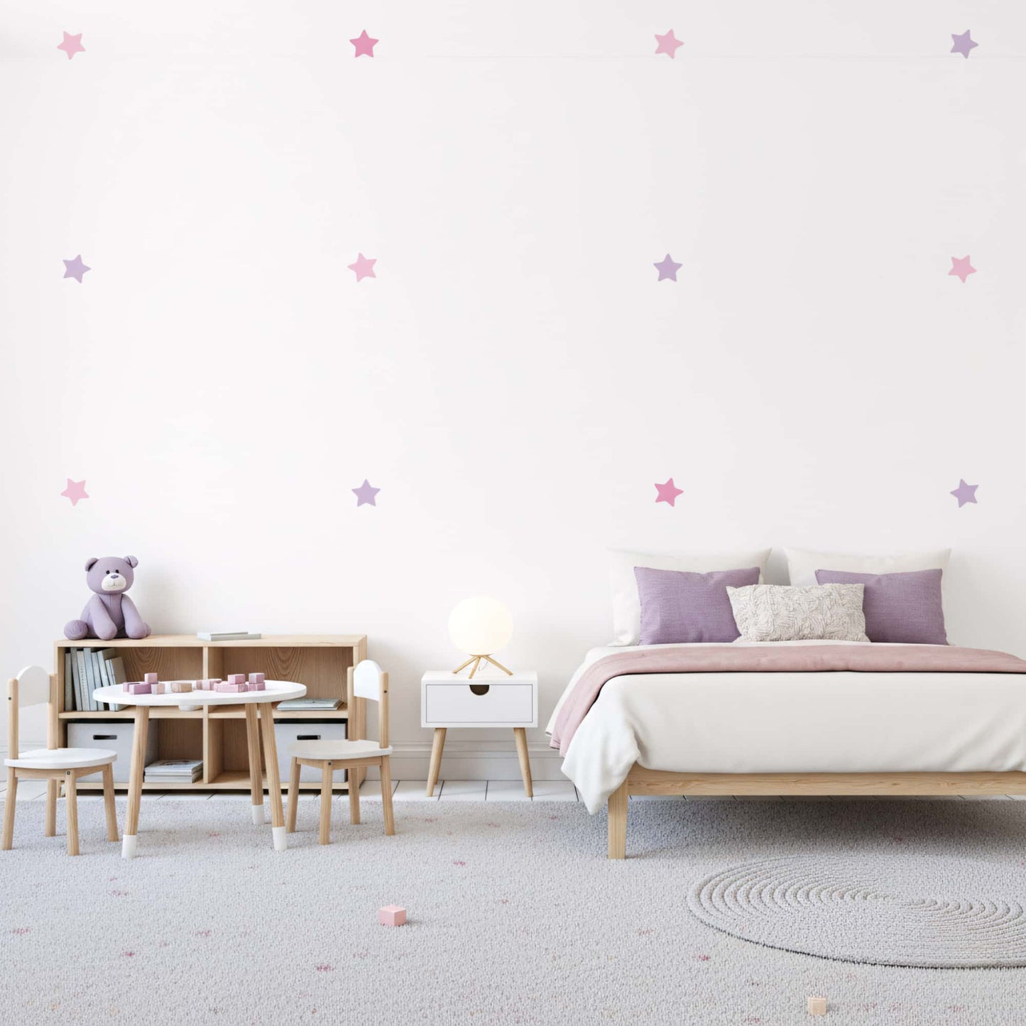 Décoration murale chambre enfant au Maroc : Stickers muraux étoiles rose bonbon, ambiance douce pour la tête de lit.